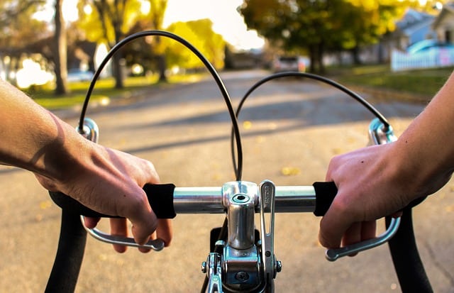 First person riding a bicycle