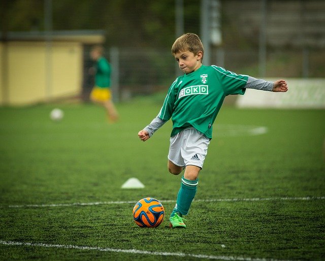 Kick boy playing soccer