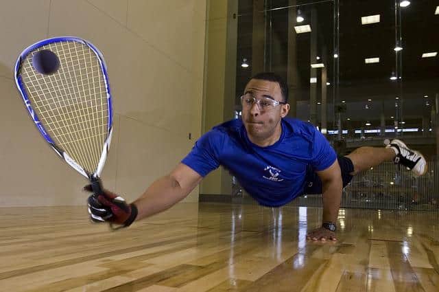 Racquetball player diving to the floor