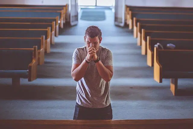 Contrition praying in church