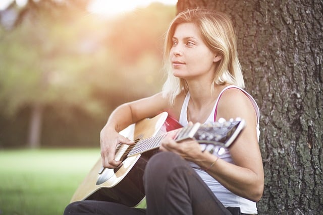 Woman playing guitar