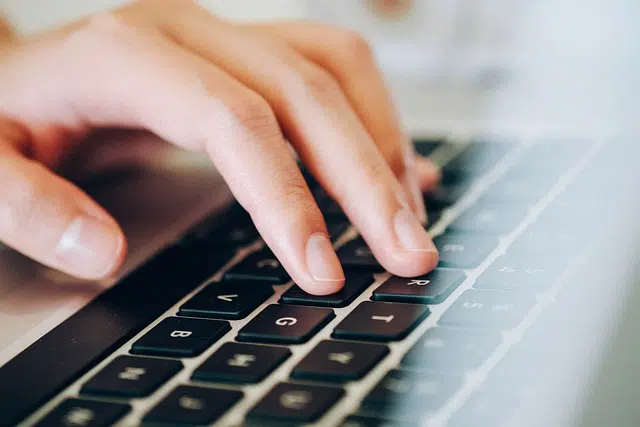 Person typing on computer