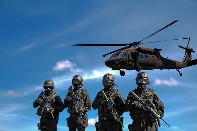 Soldiers and helicopter