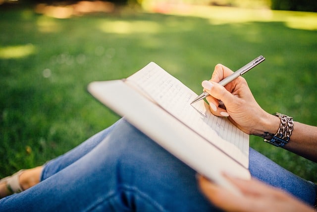 Woman writing with pen