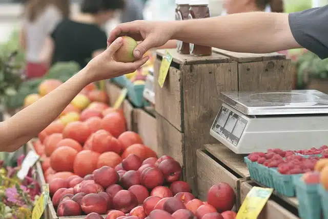 Person buying fruit