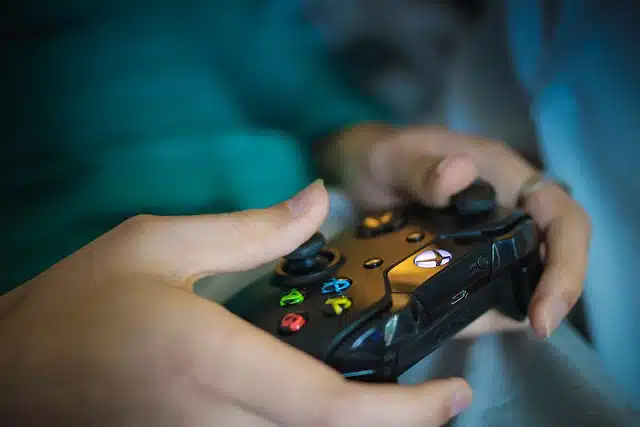 Person playing with Xbox One controller