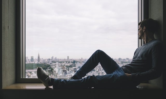 Boy sitting by a window