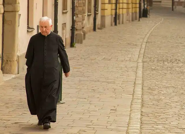 Priest walking down the street