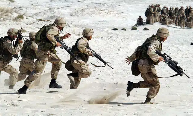 Soldiers advancing through the sand