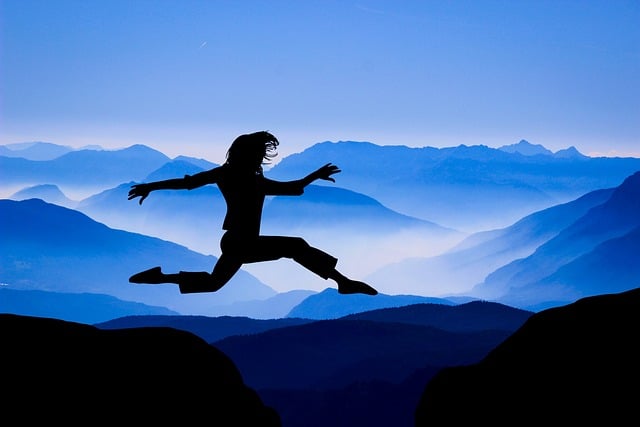 Woman jumping on the mountain