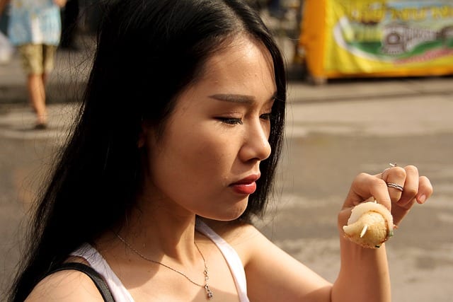 Woman looking at food with apprehension