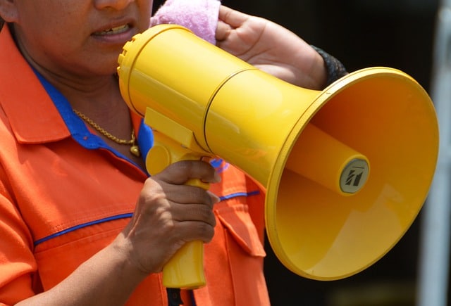 Person speaking through megaphone