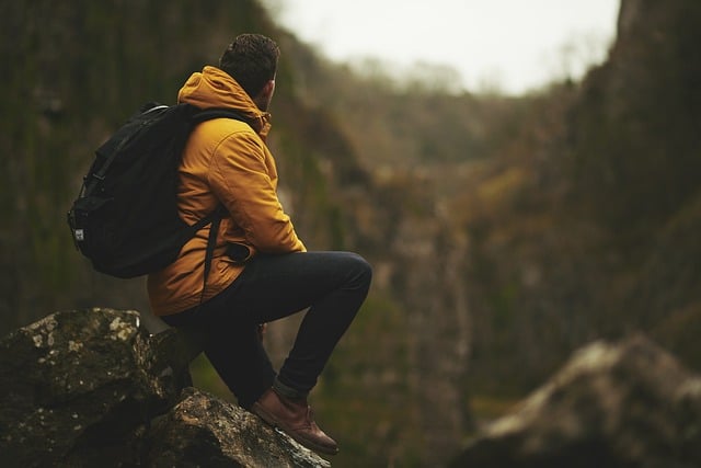 Boy sitting on a rock