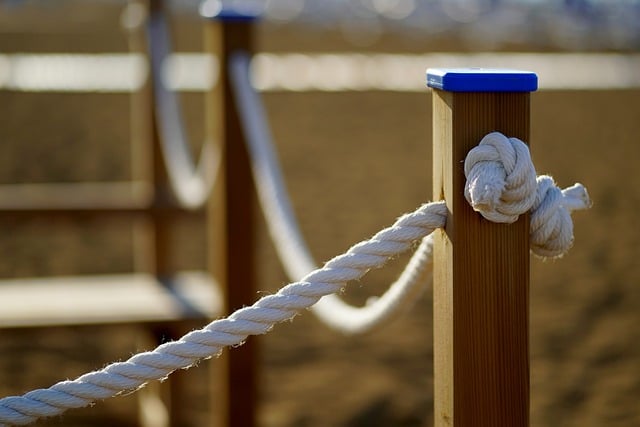 Wooden fence and rope