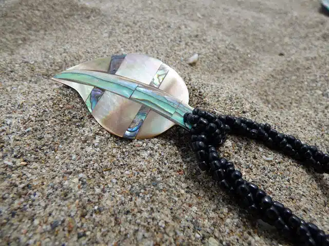 Colorful pendant in the sand