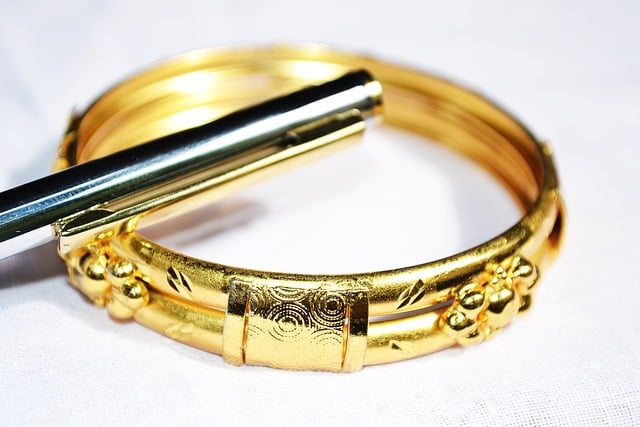 Silver pen and gold bracelet