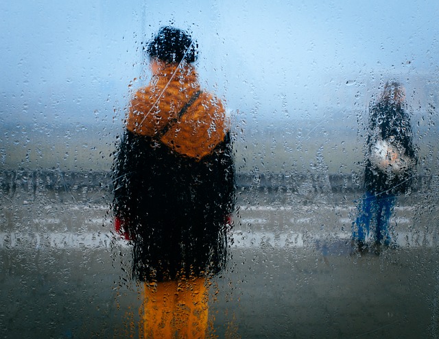 Two people in the rain