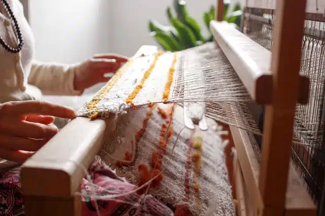 Woman operating a loom