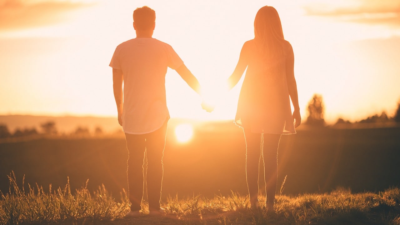 Heterosexual couple at sunset