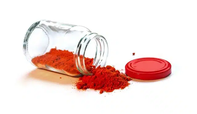 Glass jar with red powder