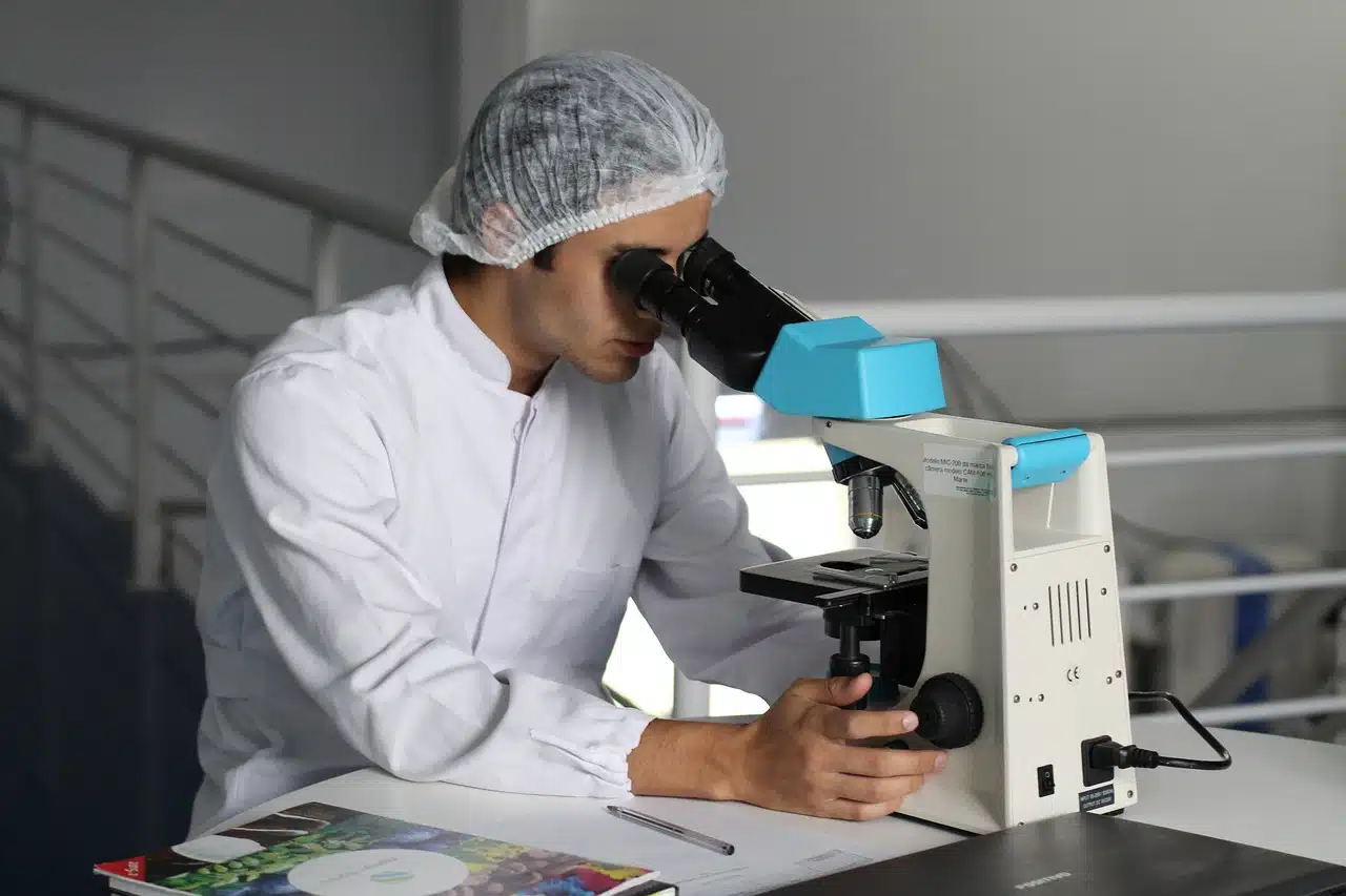 Scientist using a microscope