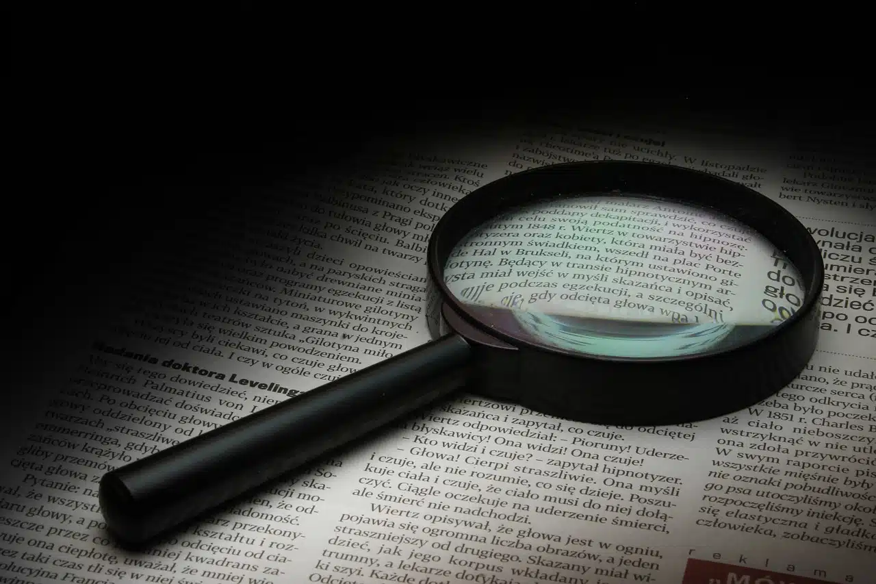 Magnifying glass on printed page