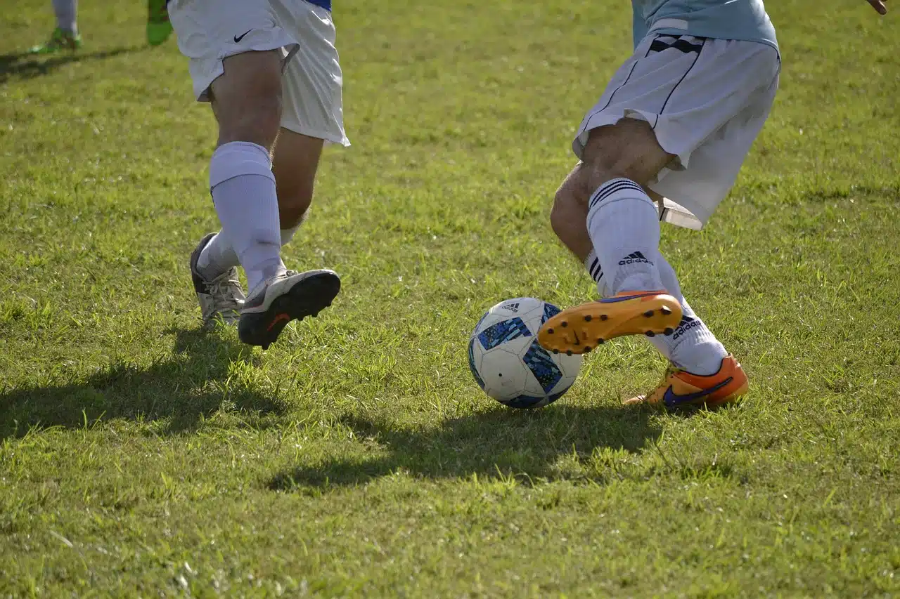 Two men playing soccer