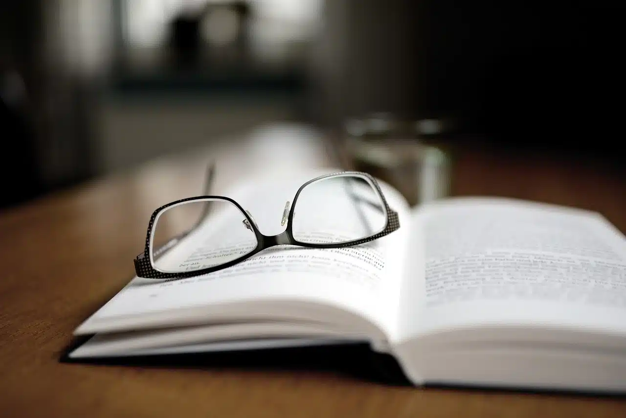 glasses on open book