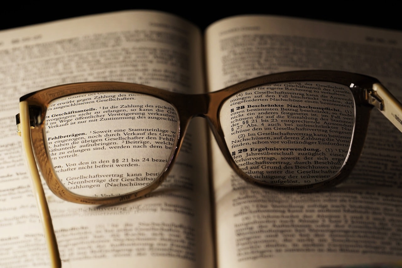 glasses on an open book