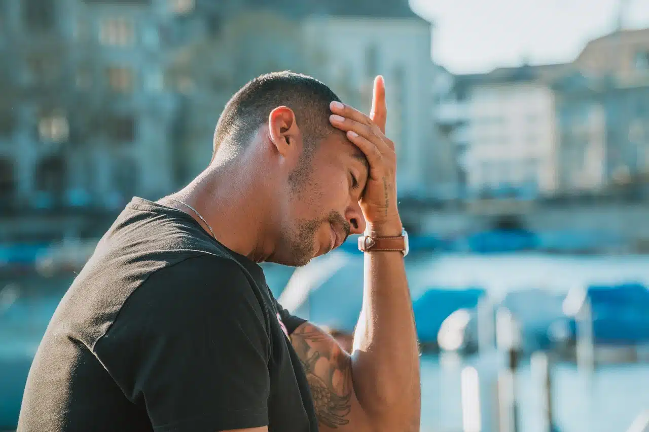 Man touching his forehead