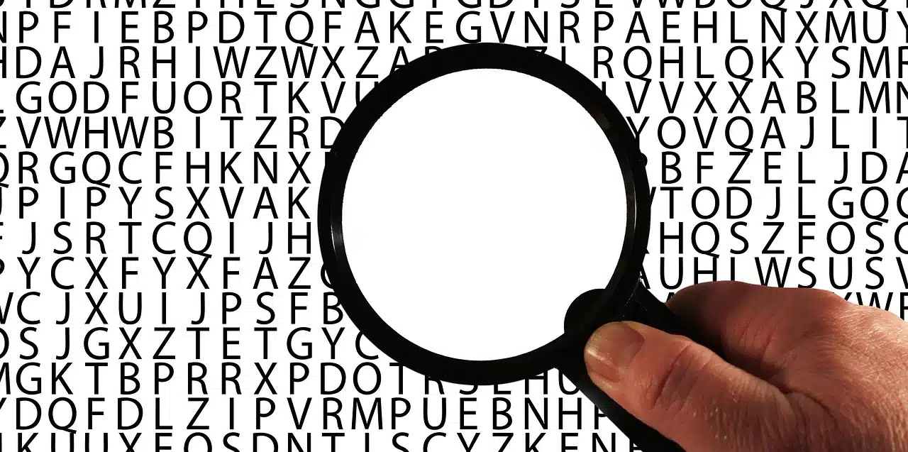 Magnifying glass on letters