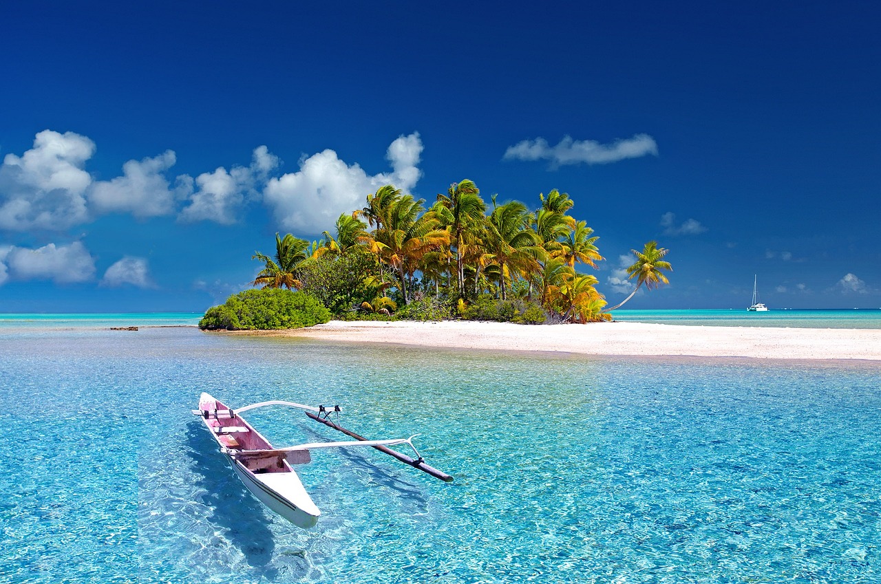 Boat in a tropical sea, near an island