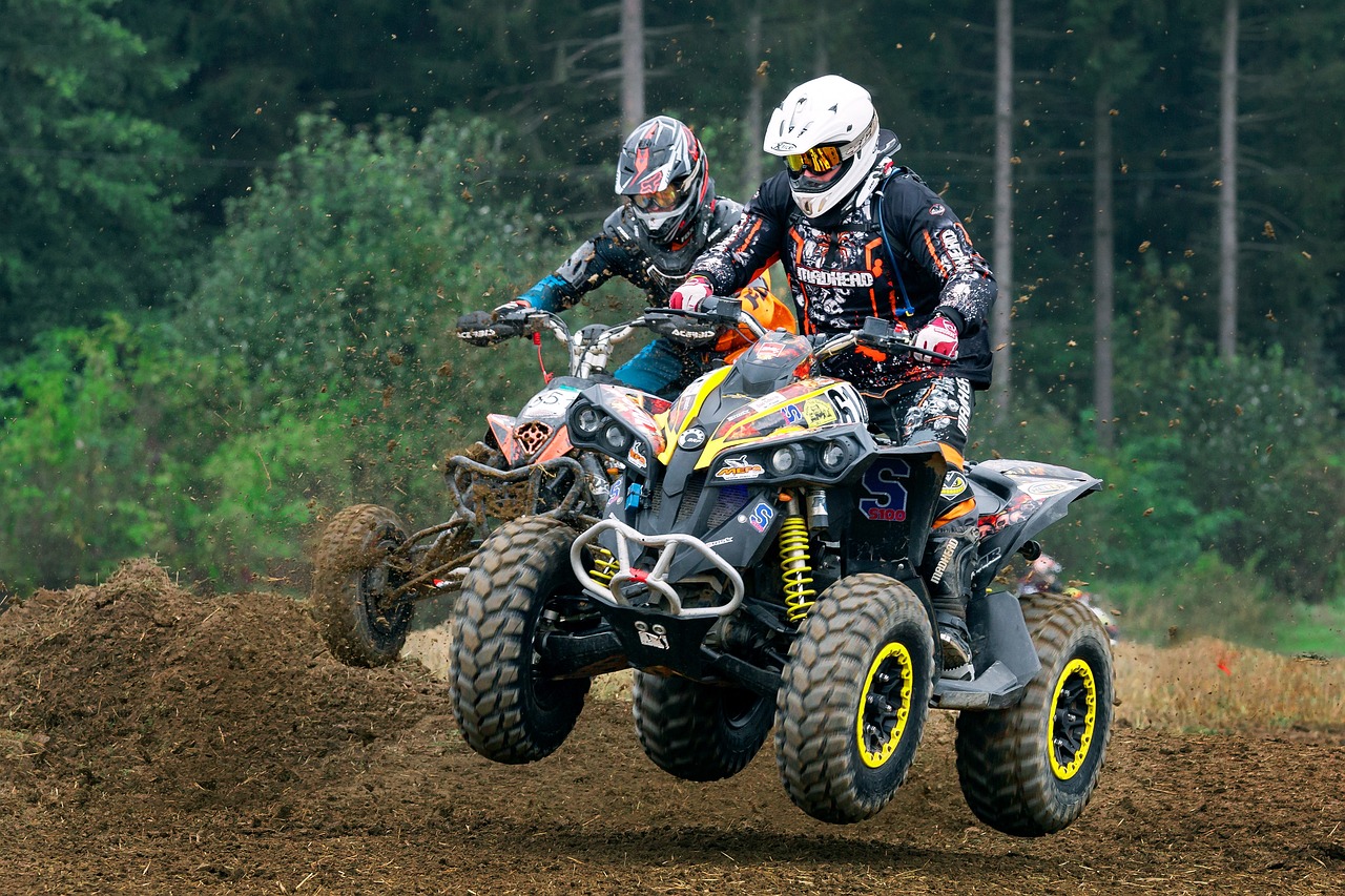 Two quadricycles through the mud