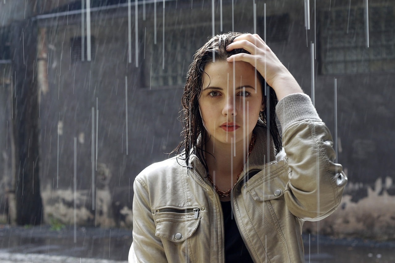 Woman with jacket in the rain