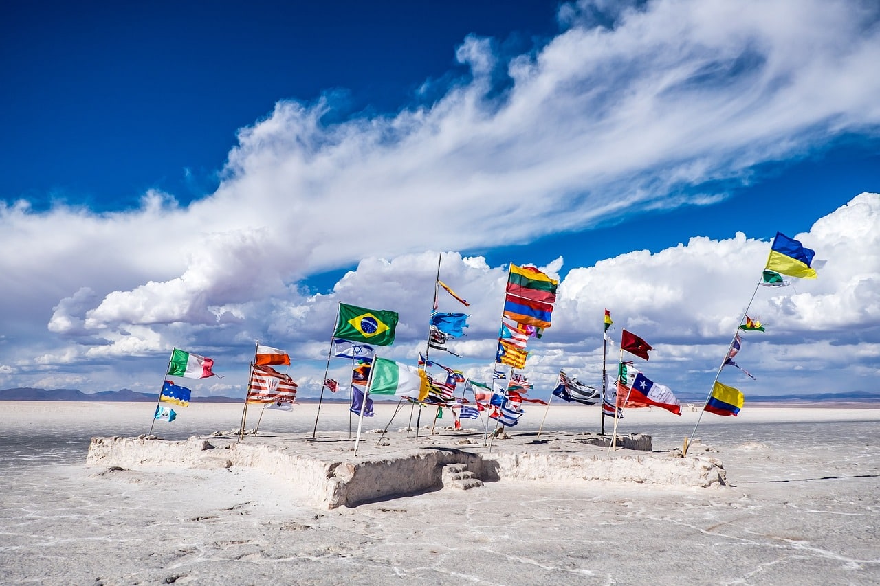 Various flags of the world on the beach