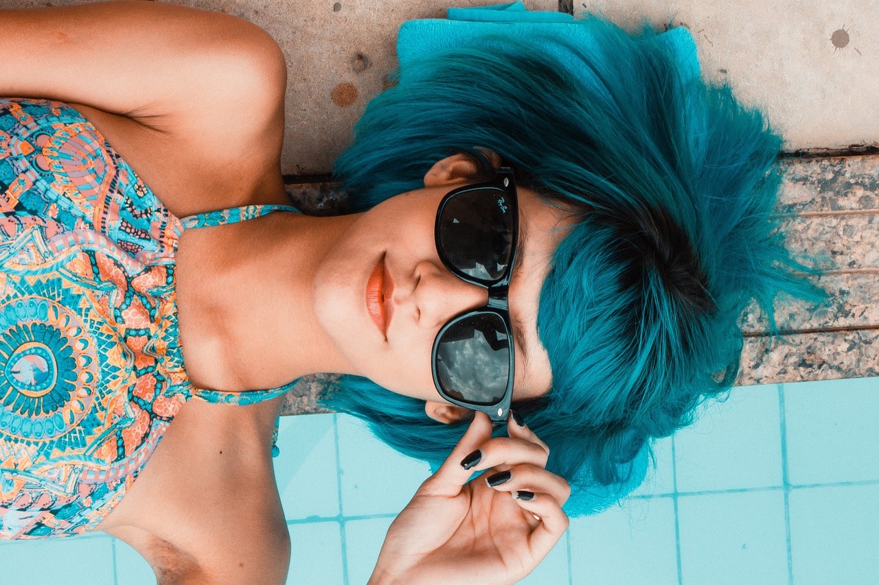 Woman sunbathing with glasses