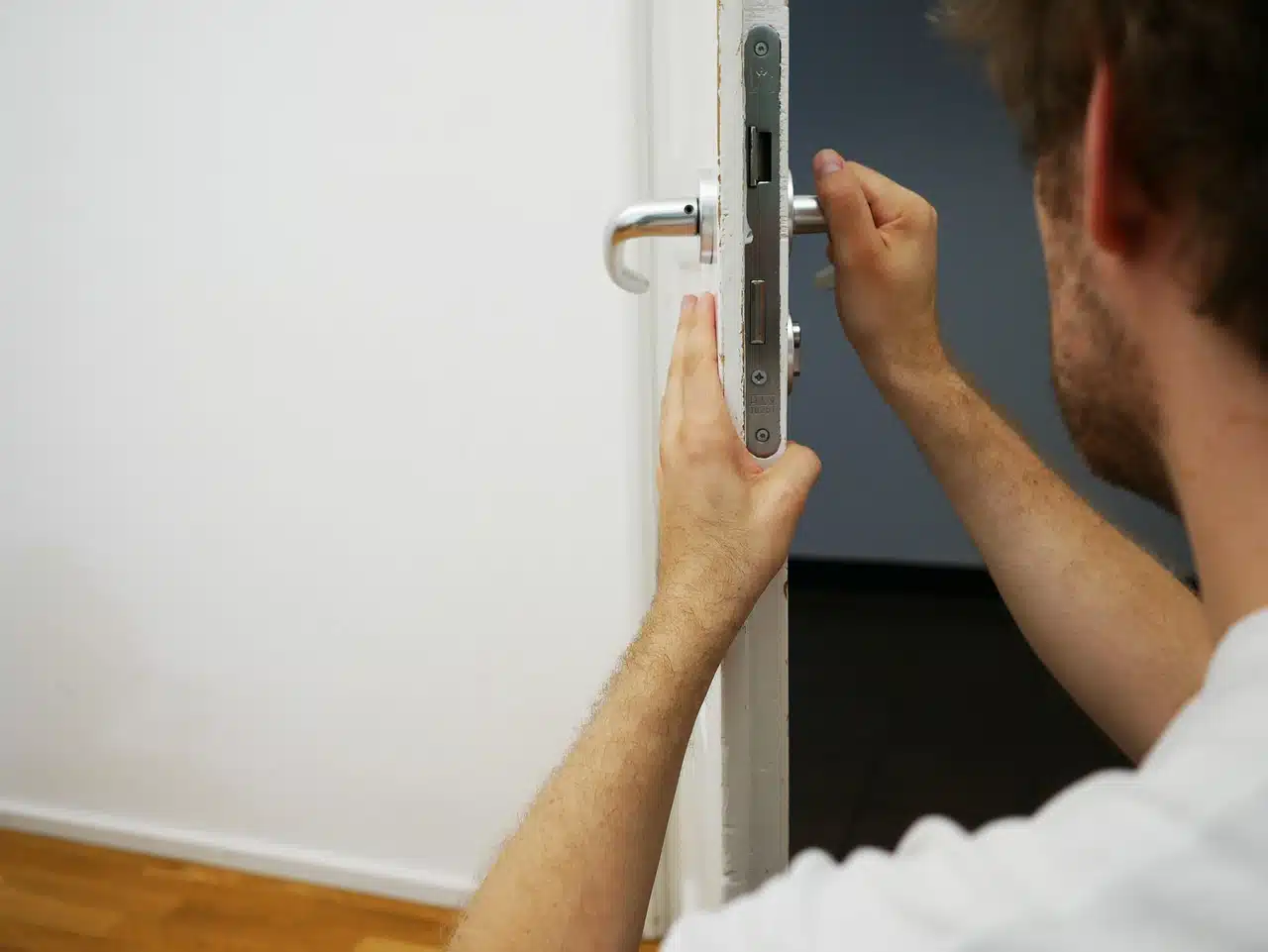 Locksmith installing a lock