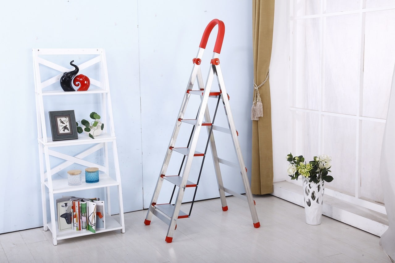 Folding ladder next to bookshelf