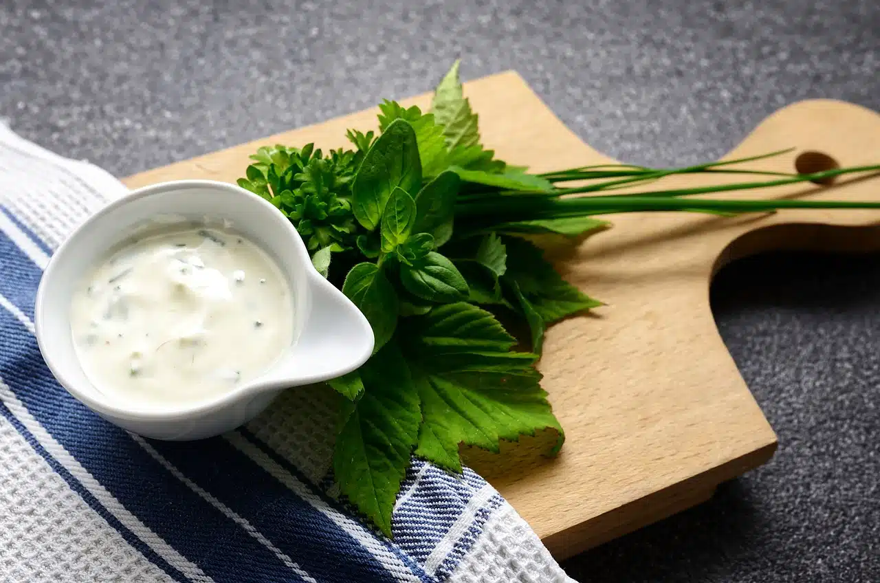 Mayonnaise on cutting board and parsley