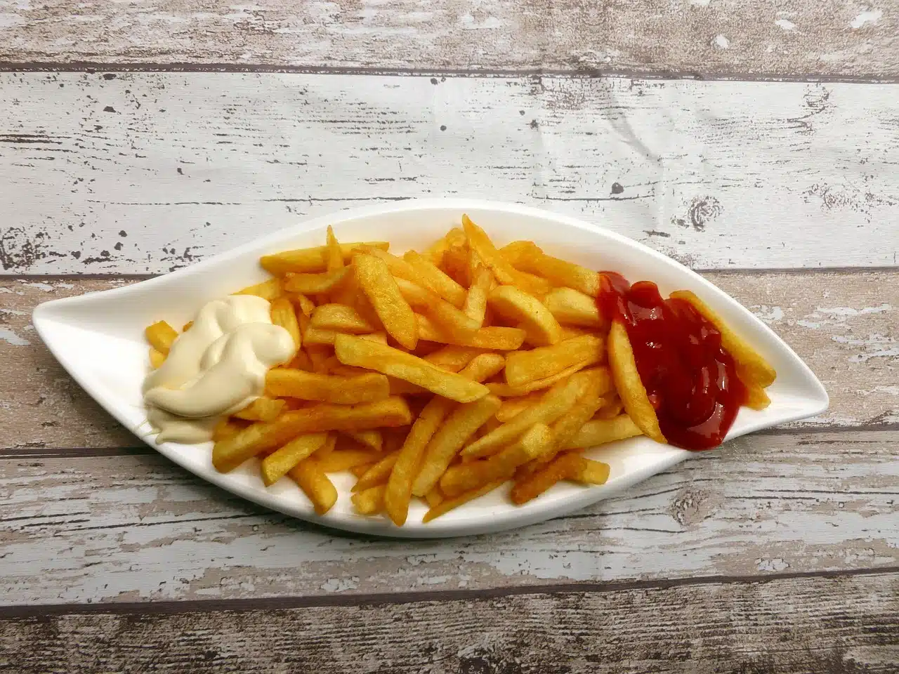 French fries with mayonnaise and ketchup