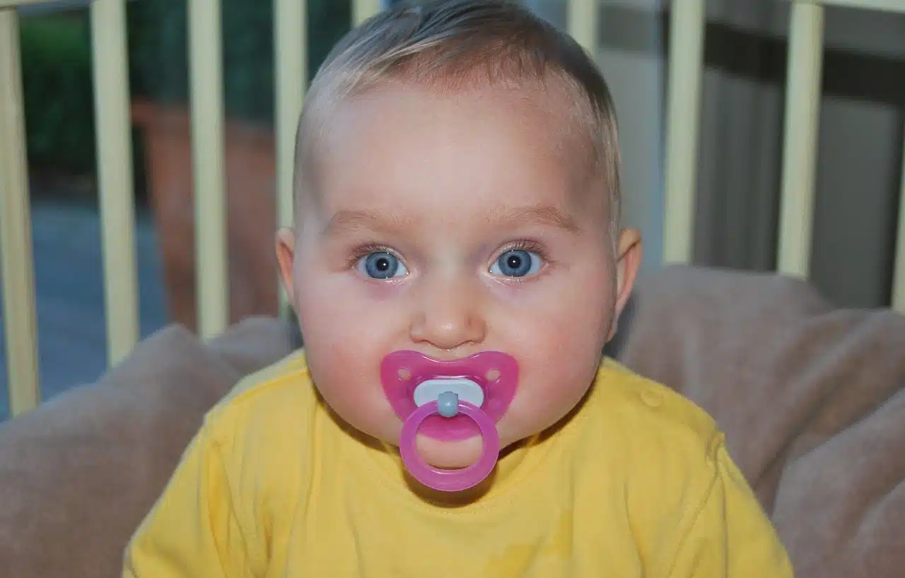 Baby with pink pacifier