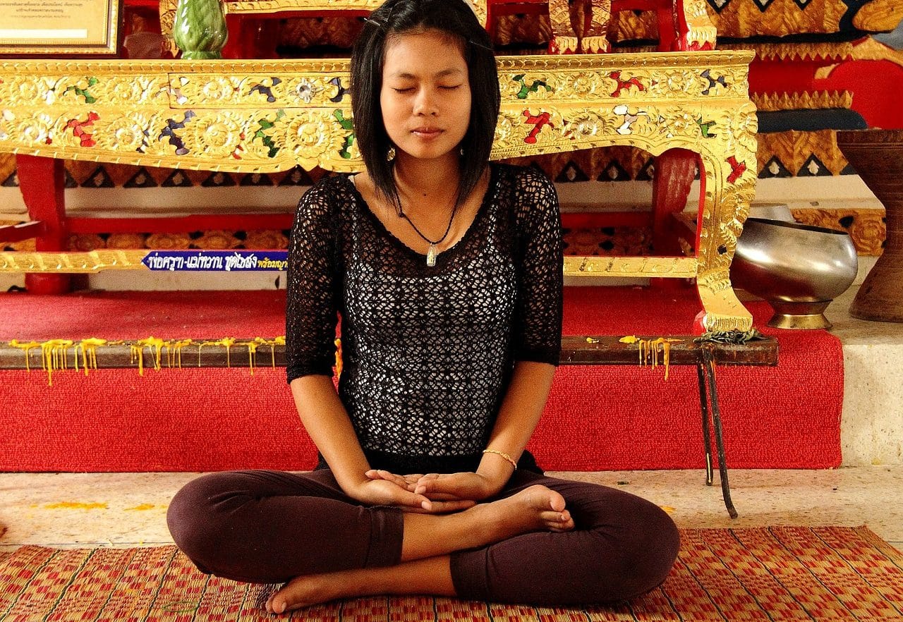 Oriental young woman doing meditation