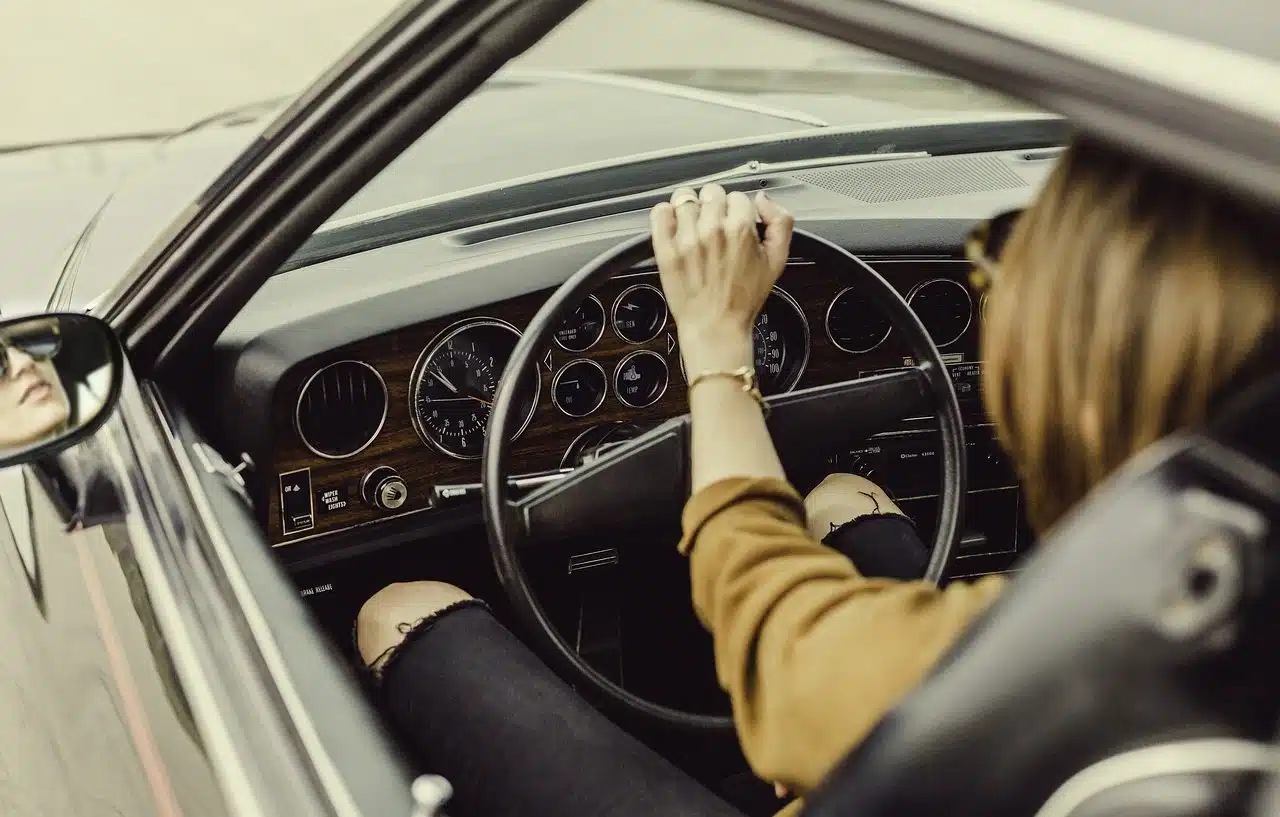 Young woman driving a vehicle