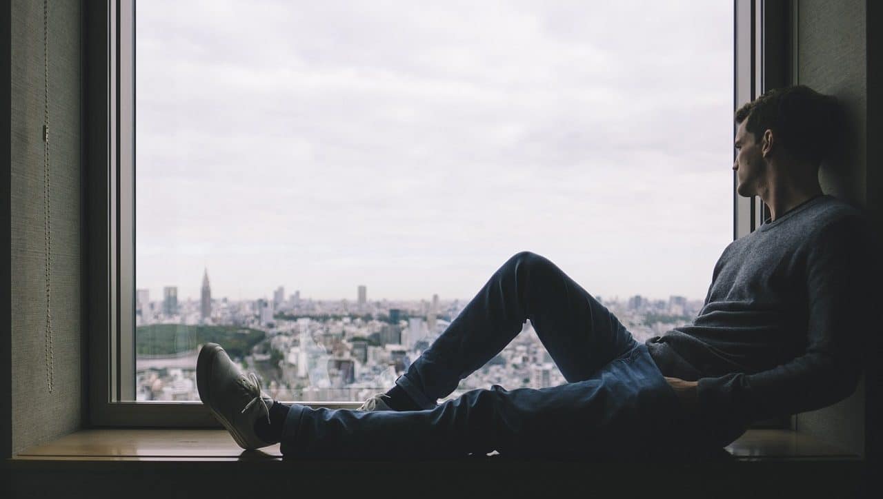 Young boy looking out the window