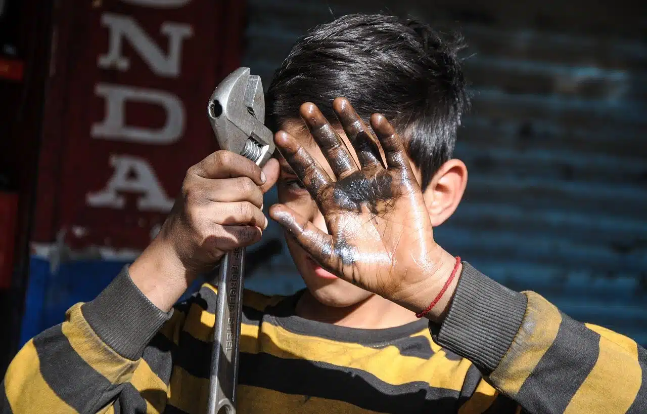 Boy holding a wrench