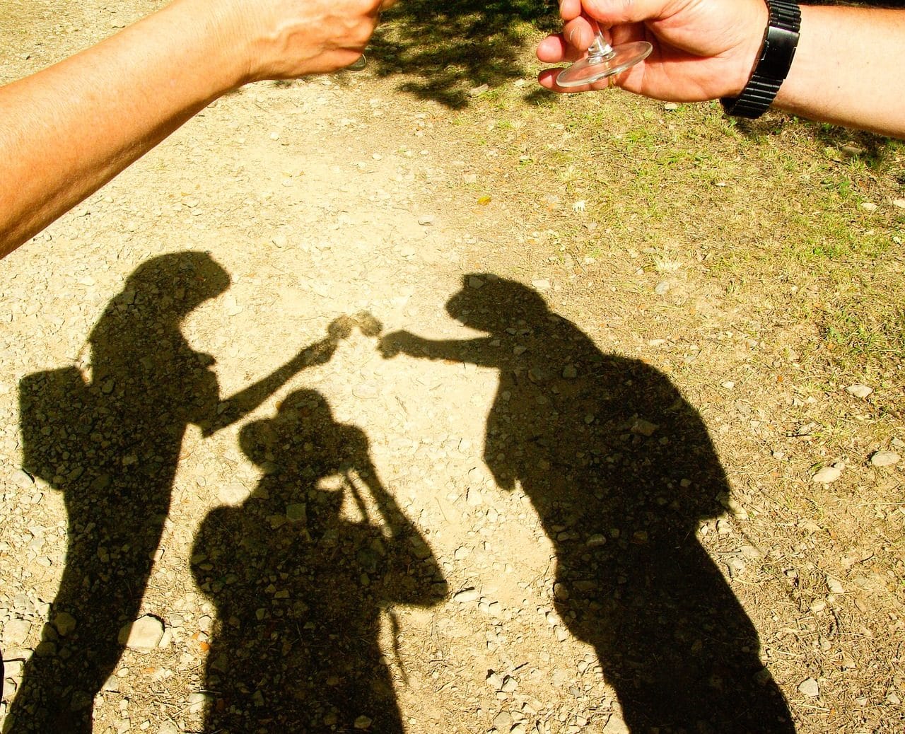 Shadows of three people