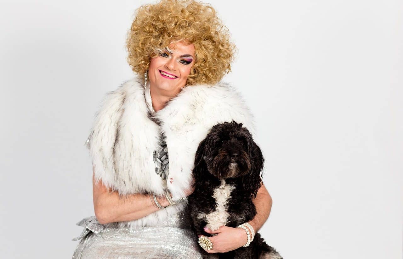 Drag queen with a black dog