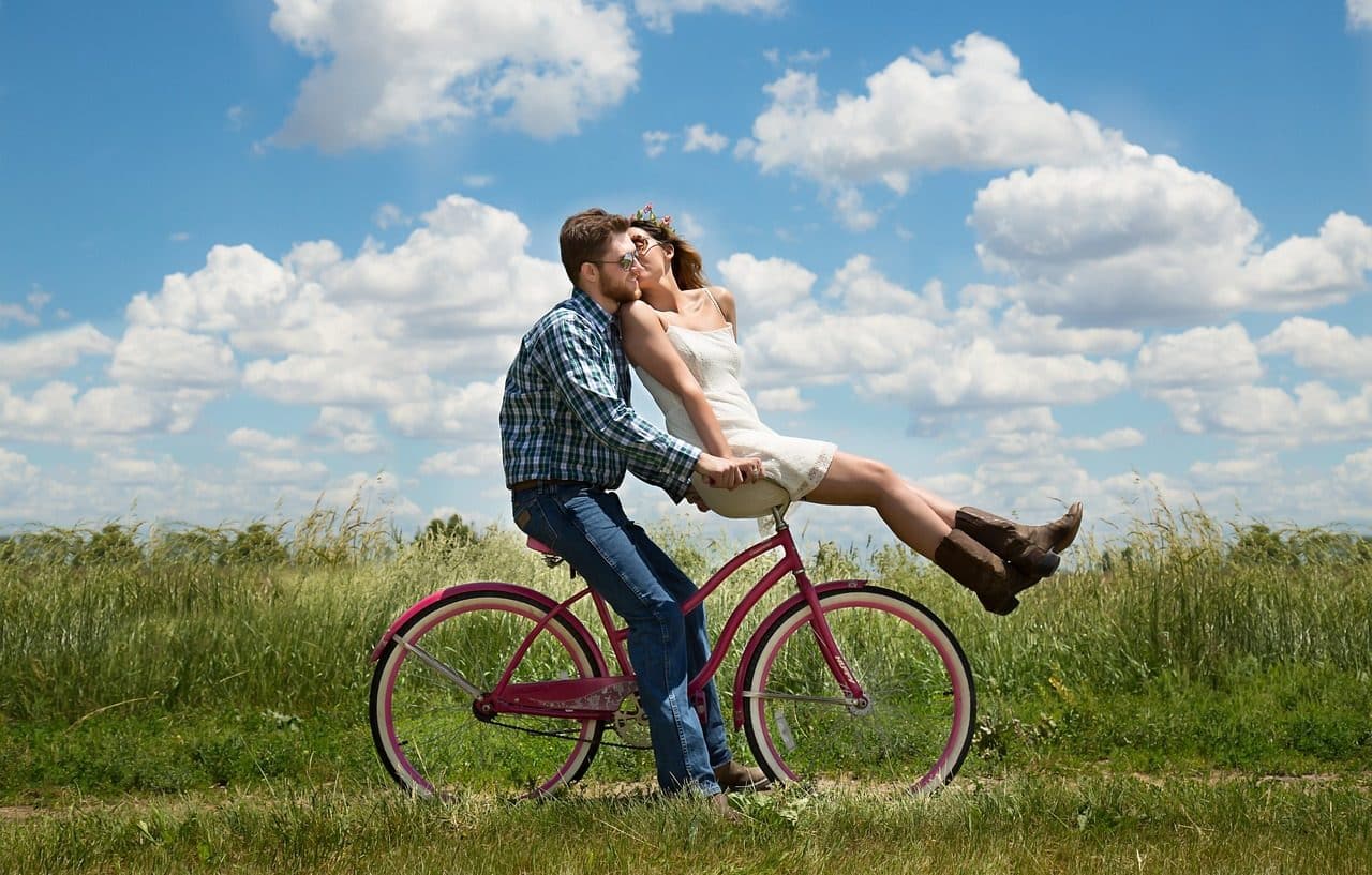 Heterosexual couple on bicycle