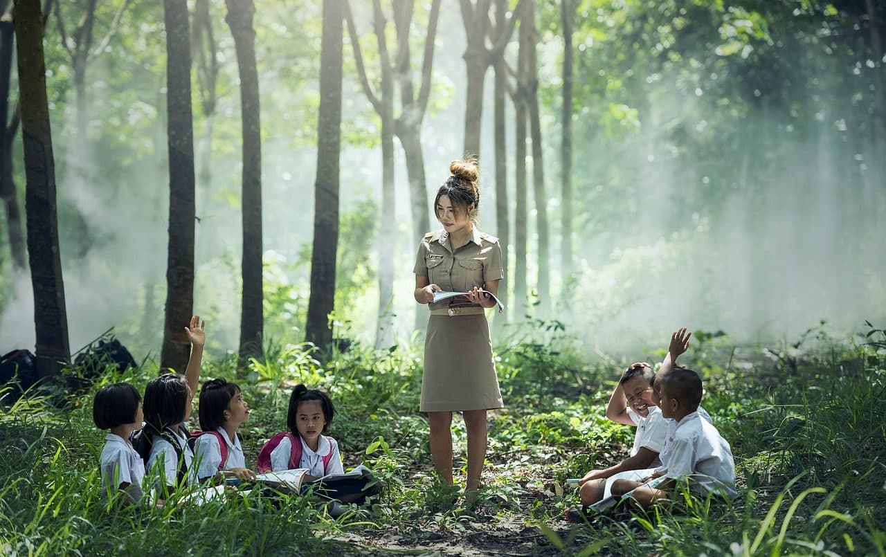 Teacher and her students in nature