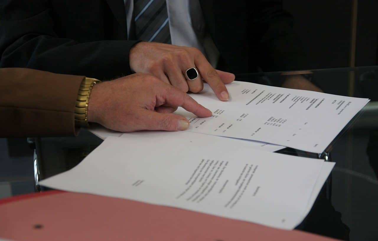 Two people reviewing a contract